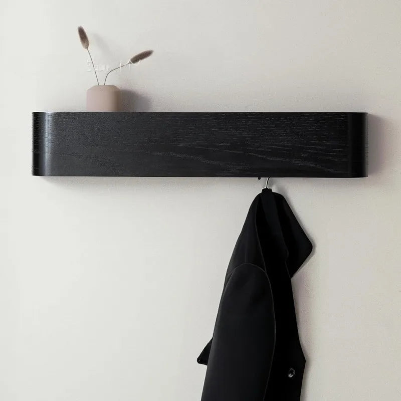 Close-up of walnut-finish wood grain texture and rounded edges on wall-mounted shelf rack