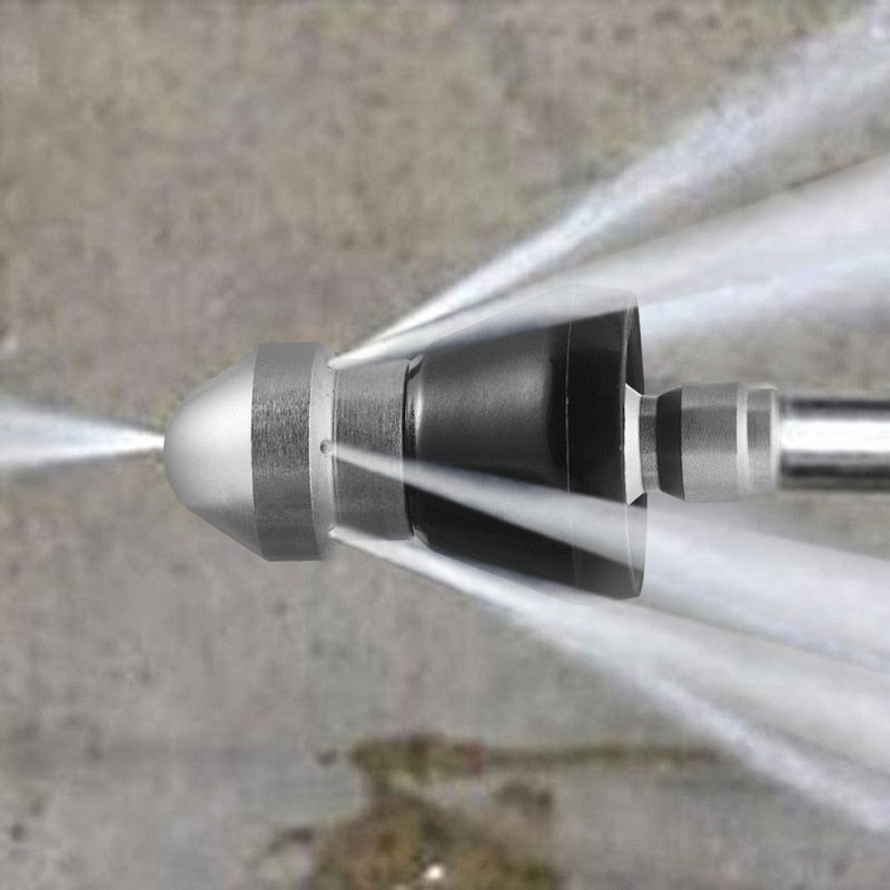Close-up macro detail of stainless steel drain nozzle spray tip showing precision jets and brushed metal finish