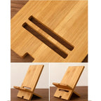 Flat-lay overhead view of bamboo phone stand on timber desk with notebook and pen styling