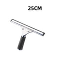 Bathroom squeegee hanging beside white towels and plant styled on neutral bathroom hook minimal calm setting