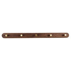 Walnut wood coat rack flat-lay on linen surface styled with brass screws and dried eucalyptus sprigs