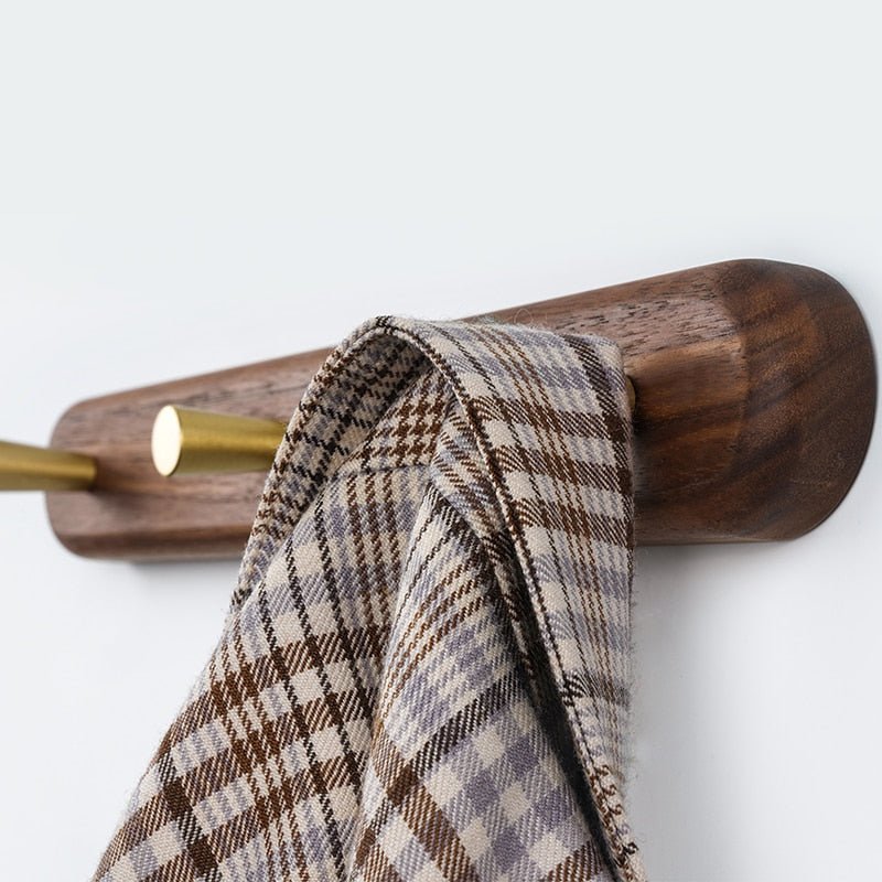 Beech wood 2-hook wall rack in bathroom with white waffle towel and robe hanging, natural light