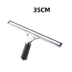 Window squeegee in use on home window with outdoor daylight through glass showing clear streak-free result