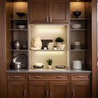 Motion sensor LED light in bathroom cabinet creating warm ambient lighting mood
