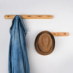 Wall Coat Rack — Walnut & Beech Wood, Brass Hooks front view on neutral background